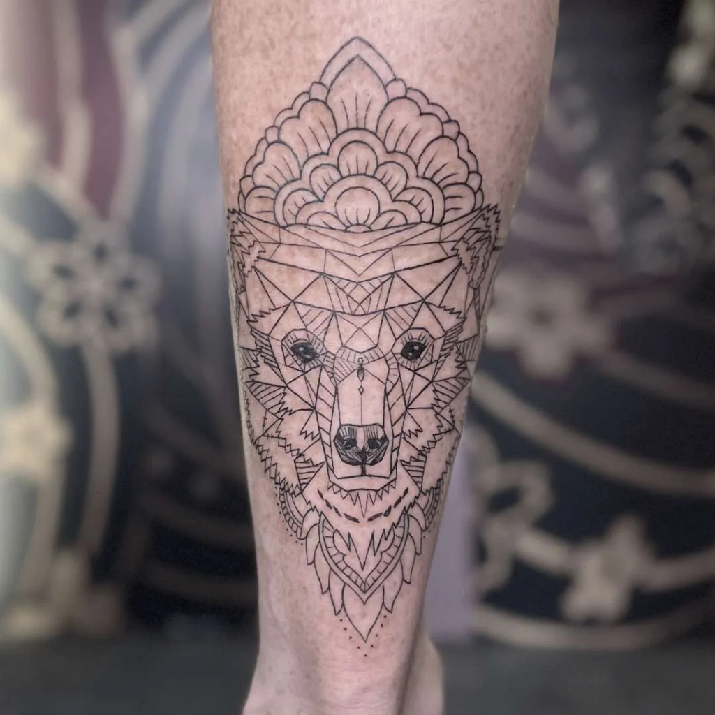 a line and geometric tattoo of a wolf